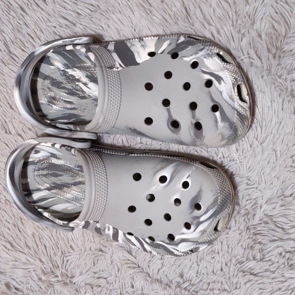 Gray and white camo Crocs.